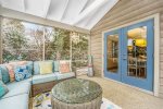 Spacious screen porch is just off the dining room